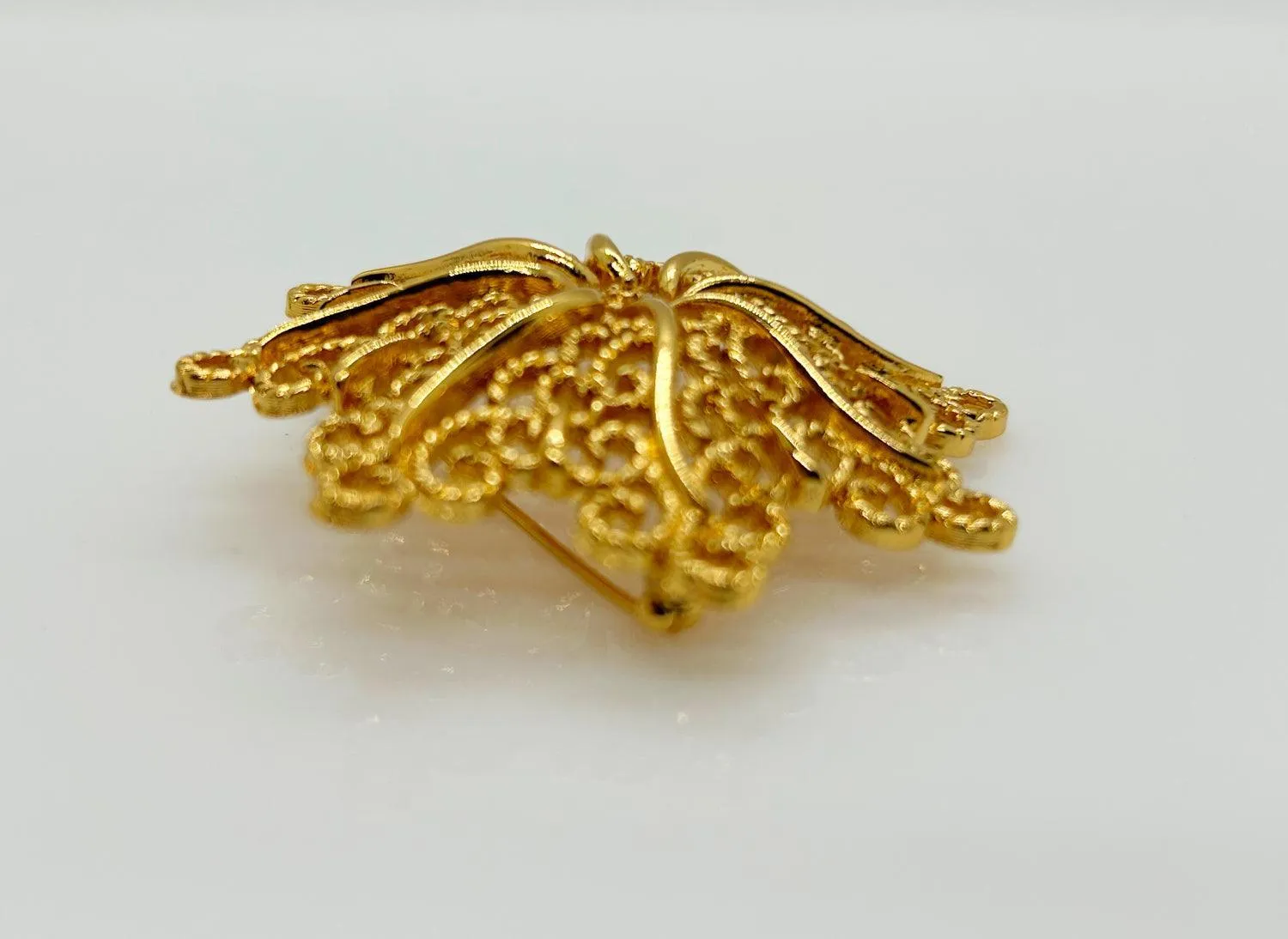 Monet Opulent Gold Tone Swirls Brooch