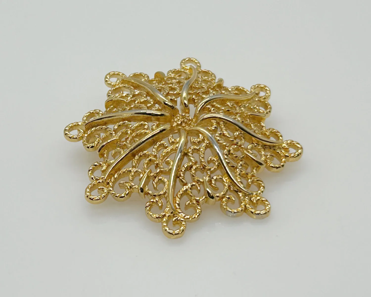 Monet Opulent Gold Tone Swirls Brooch