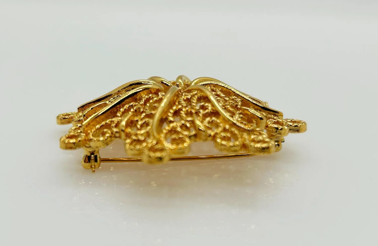 Monet Opulent Gold Tone Swirls Brooch