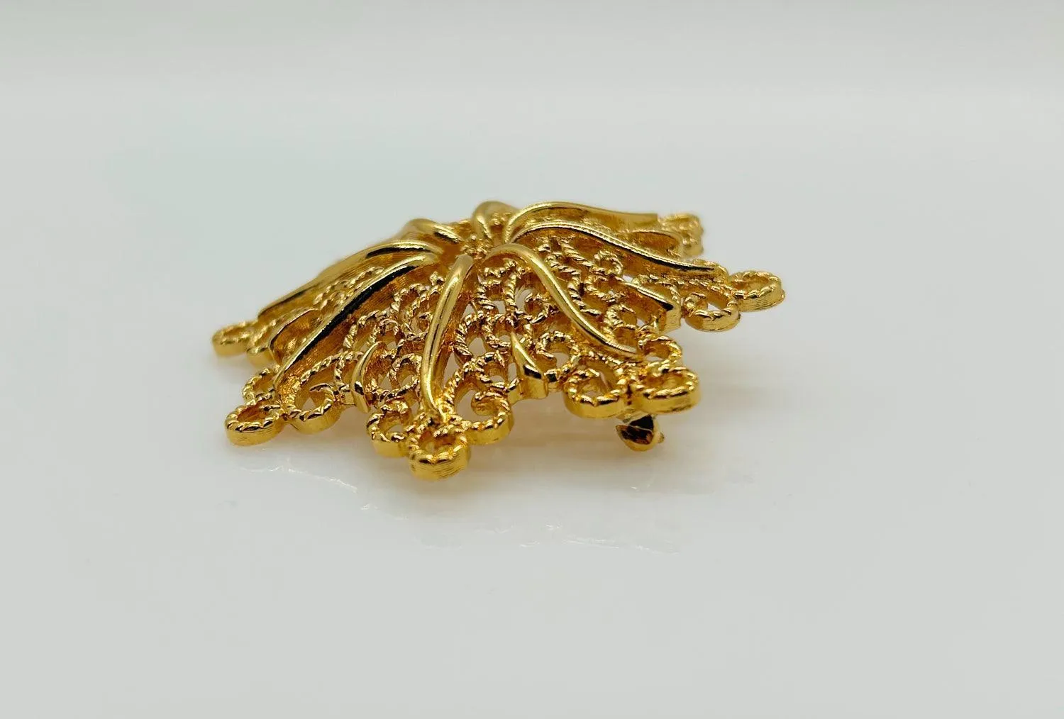 Monet Opulent Gold Tone Swirls Brooch